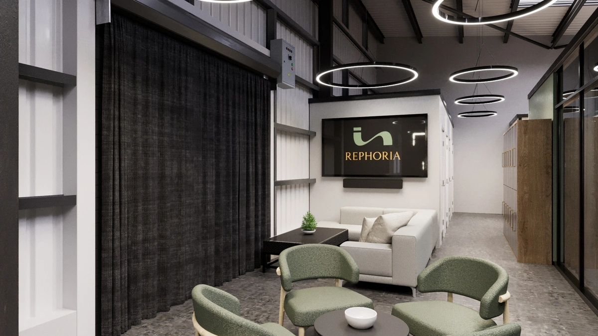 Modern Rephoria office lobby featuring green armchairs, a white sofa, and digital brand signage.